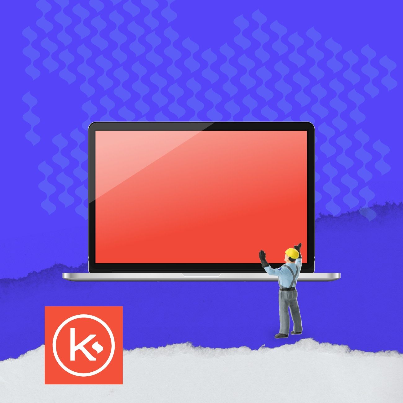 a laptop next to a construction worker toy